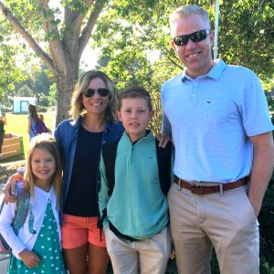 family of four under a tree