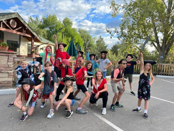 students dressed as pirates striking a dramatic pose