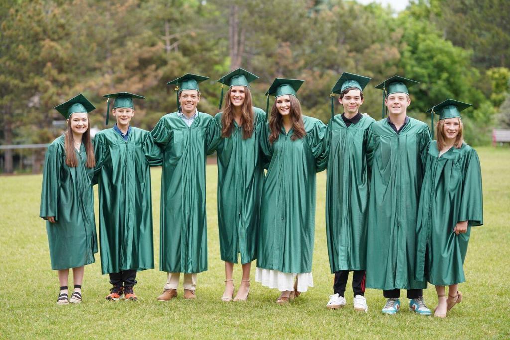 mackintosh academy graduates on campus field